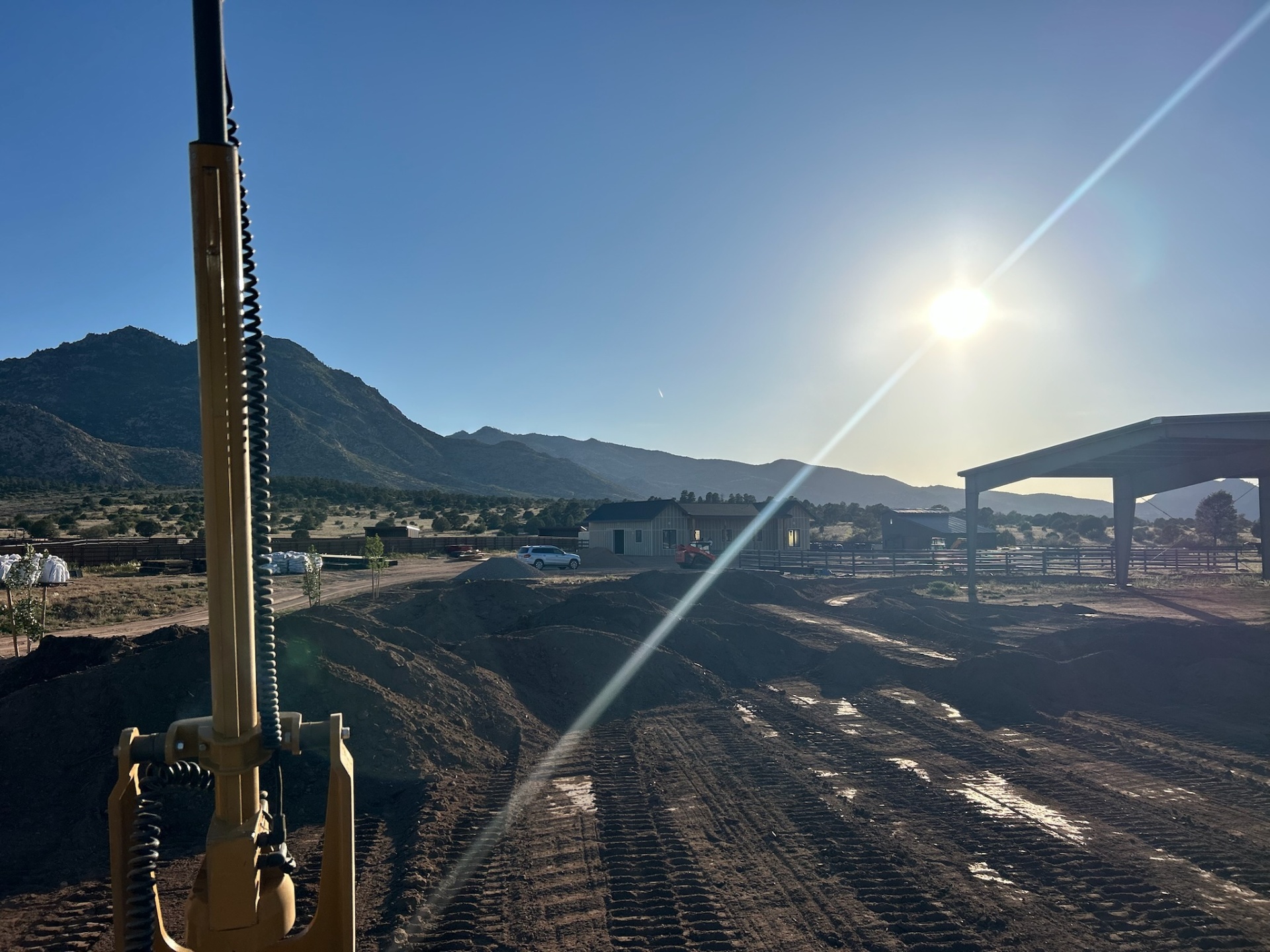 Prescott AZ Site Grading & Cover Sitework and grading for a Prescott, Arizona equestrian property with covered arena and Bradshaw Mountains in background